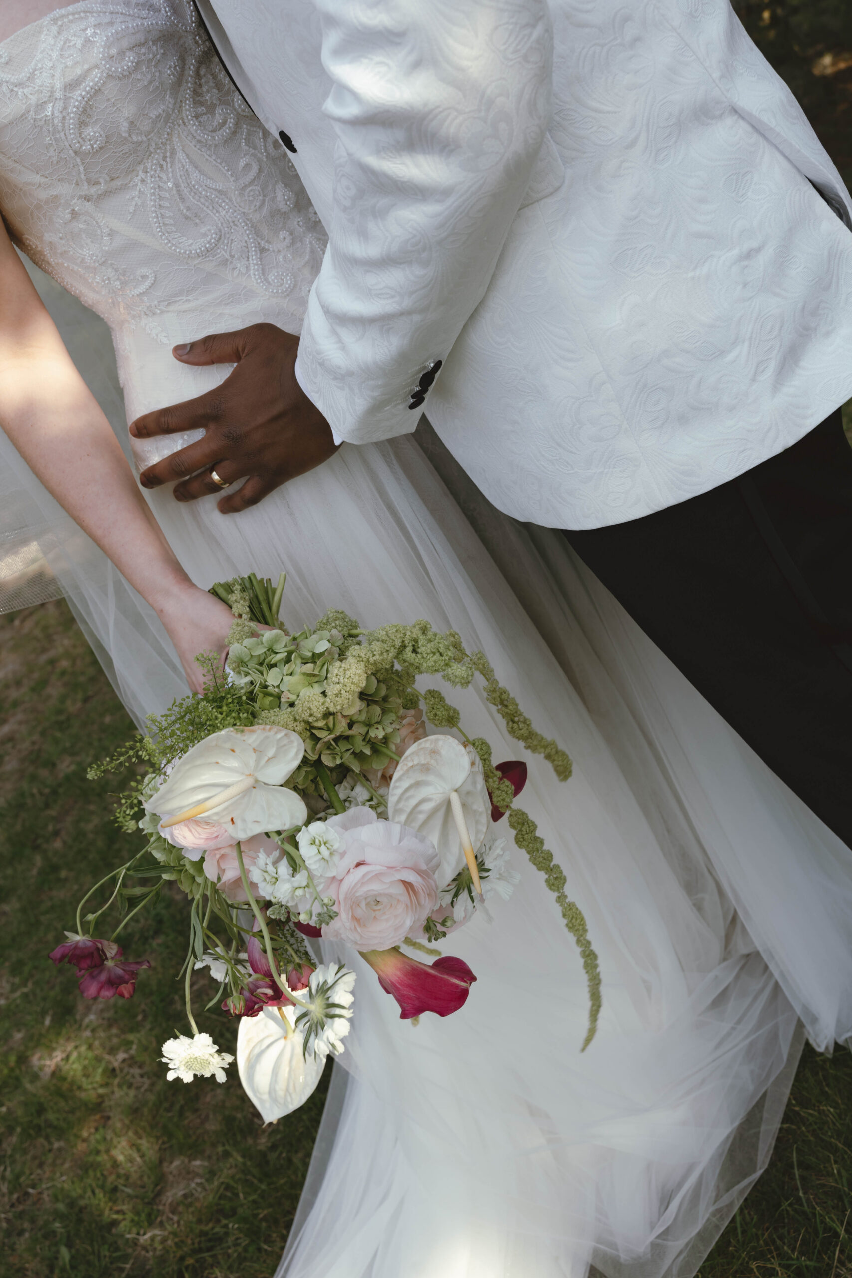 two people in a forest with a bouquet